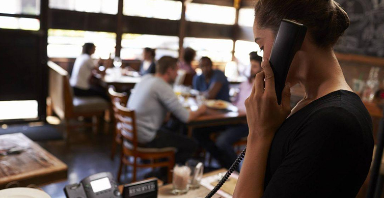 Restaurant staff managing manual food orders without digital ordering system 